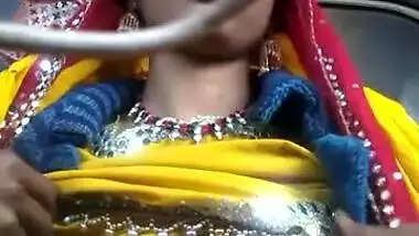 Desi chick pulls her bright dress up to demonstrate big XXX boobs