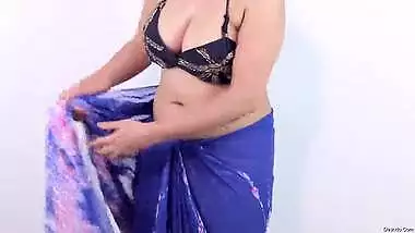 Booby fat aunty wearing black dot sari showing huge cleavage and hot navel