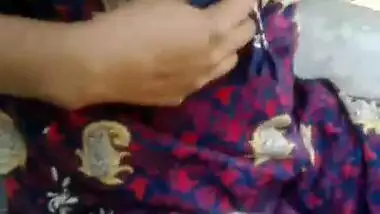 Lovely Desi woman talks with neighbor with her XXX breasts exposed